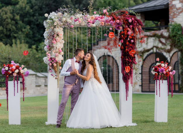 wedding-archway-backyard-happy-wedding-couple-outdoors-before-wedding-ceremony_8353-11057