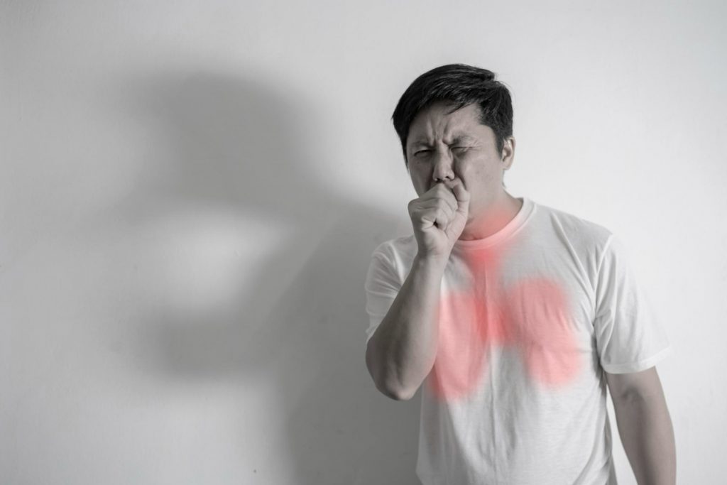 handsome-man-coughing-into-his-fist-isolated-white-background-man-about-forty-years-old-had-strong-cough